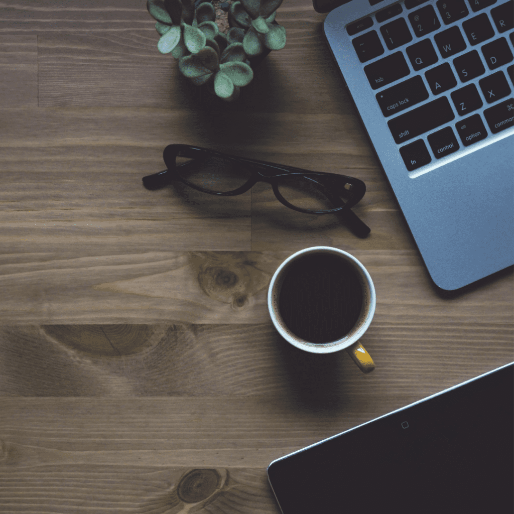 coffee and laptop open to write a psychology today profile